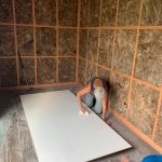 Gerry's mum (Sandra) sanding the wall boards.