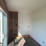 The wall linings start to go up.