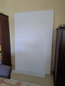 The blank canvas stretched on the wooden stretcher bars