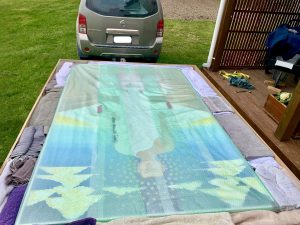 The painting packed carefully in the wooden trailer crate